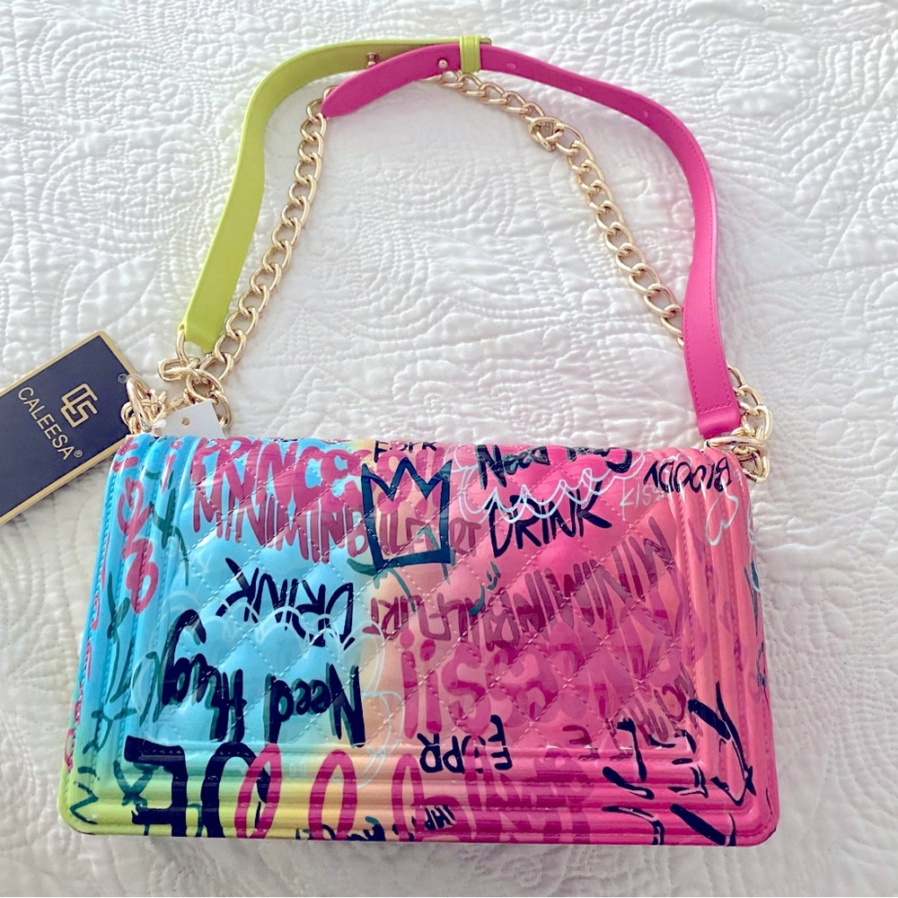 New Caleesa graffiti jelly fold over flap crossbody bag with gold tone hardware. - Picture 2 of 3
